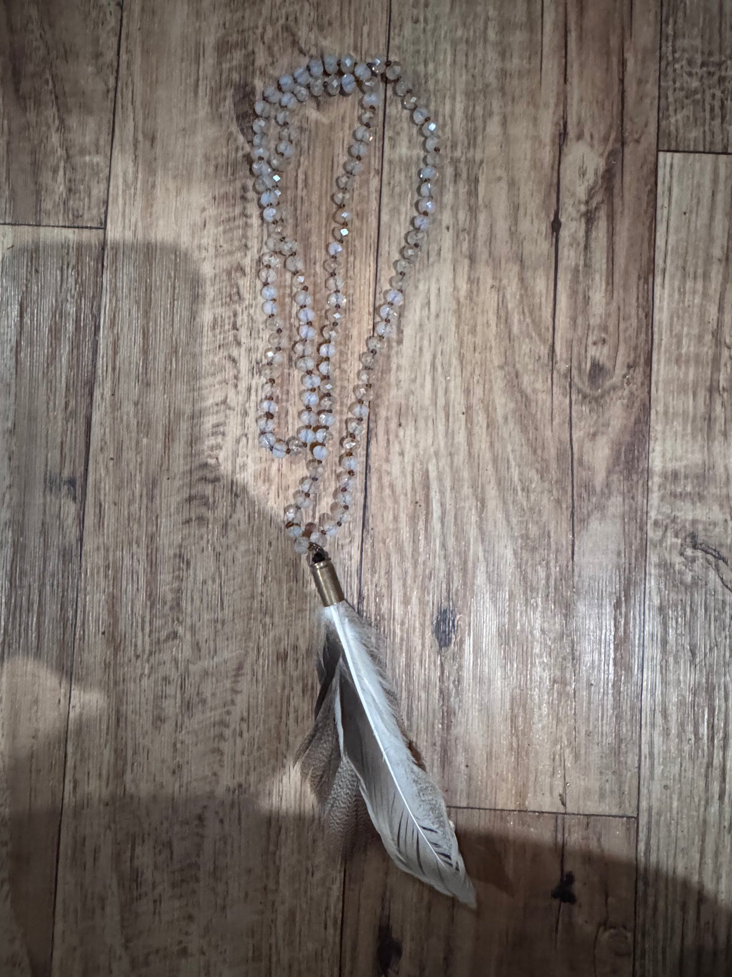 ARB’s Clear Beads with Feather Pendant