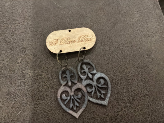 A Rare Bird’s Hand cut Leather Filigree Earrings