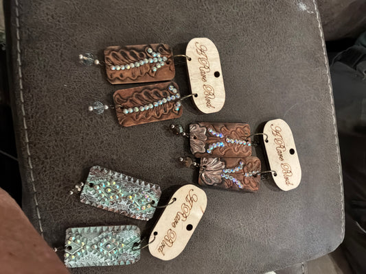 A Rare Bird’s Hand-tooled Leather Earrings