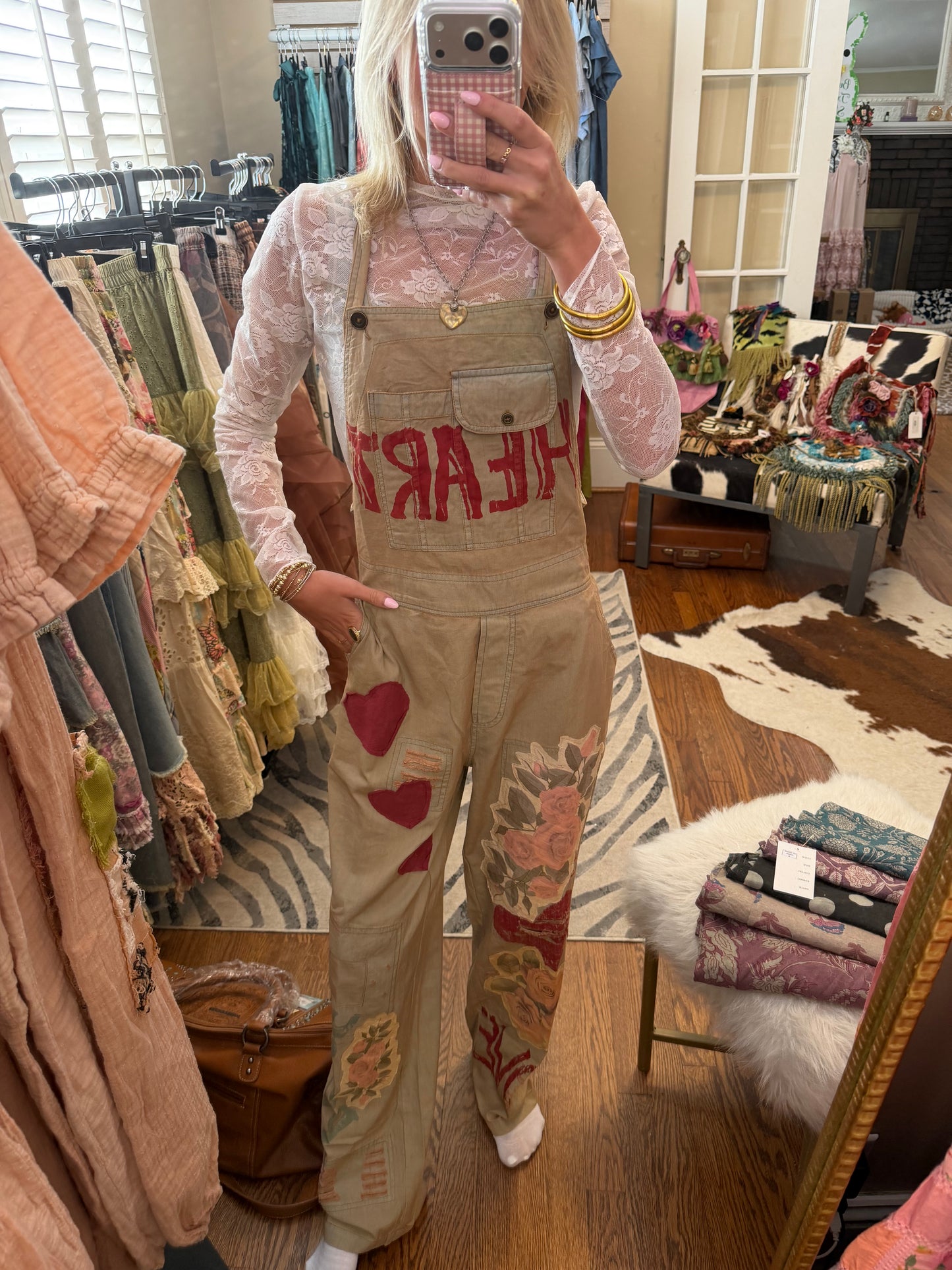 Embroidered overalls, relaxed, fitted, distressed design with all of her prints and patches – khaki